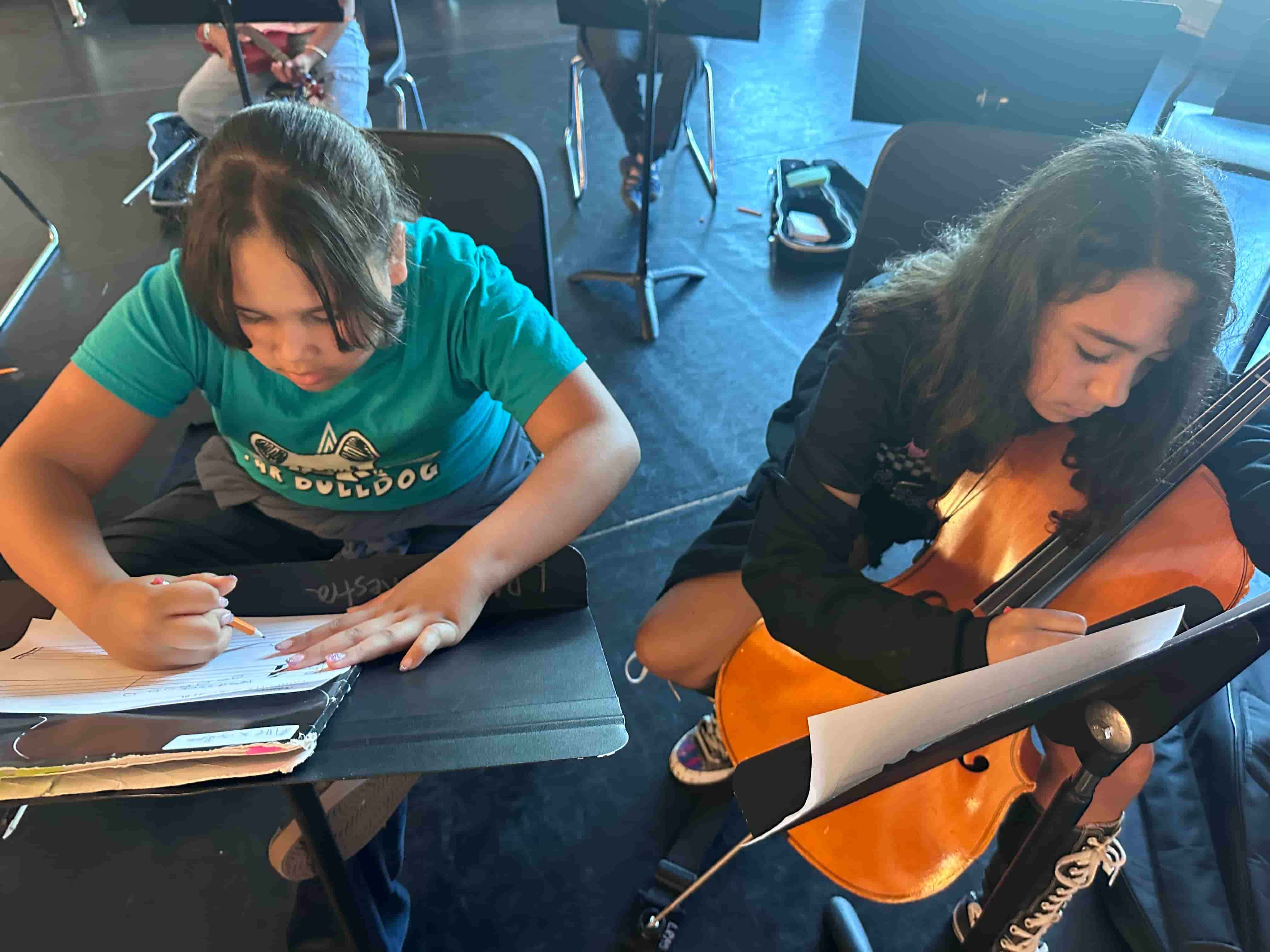 Students composing original music during Brandi Hart musical enrichment workshop