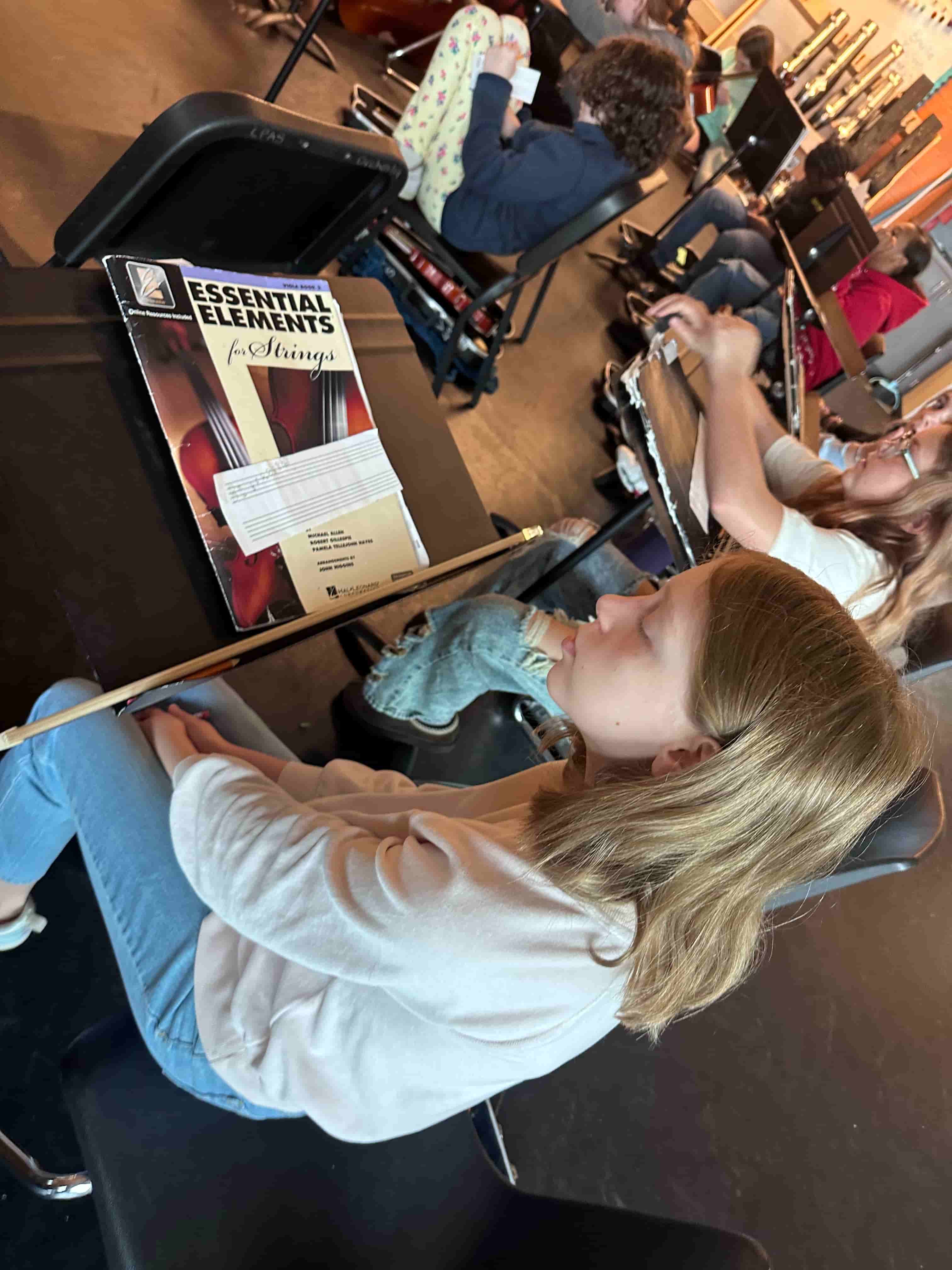Student reviewing original composition during Brandi Hart musical enrichment workshop